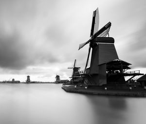 Traditional windmill against sky