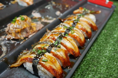 Close-up of serving meat on barbecue grill