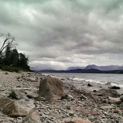 Scenic view of sea against cloudy sky