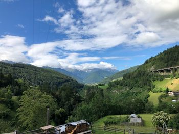 Scenic view of landscape and mountains against sky