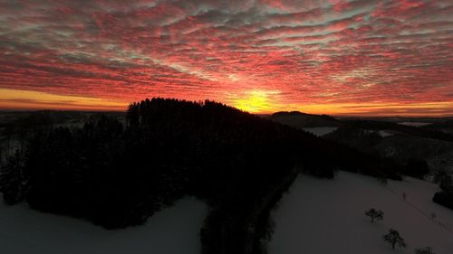 Scenic view of dramatic sky during sunset