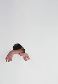 Young woman against white background