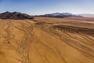 Scenic view of desert against clear sky