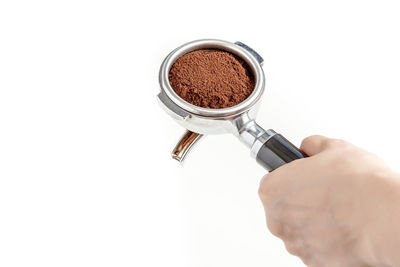 Close-up of hands over white background