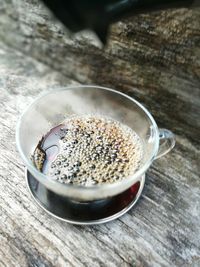 High angle view of coffee cup on table