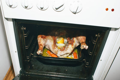 High angle view of meat on barbecue grill