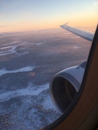 Aerial view of sky seen through airplane window