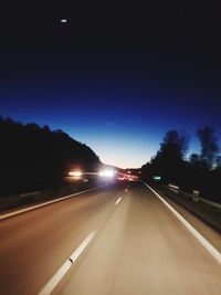 Cars on highway at night