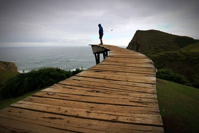 Pier over sea against sky