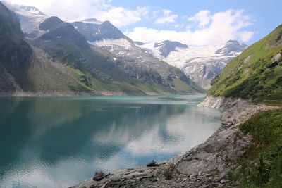 Scenic view of lake and mountains against sky