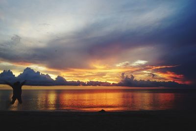 Scenic view of lake against sky during sunset