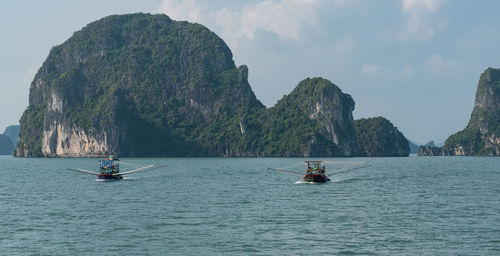 Fishing boat while fishing in halong bay at hanoi, vietnam