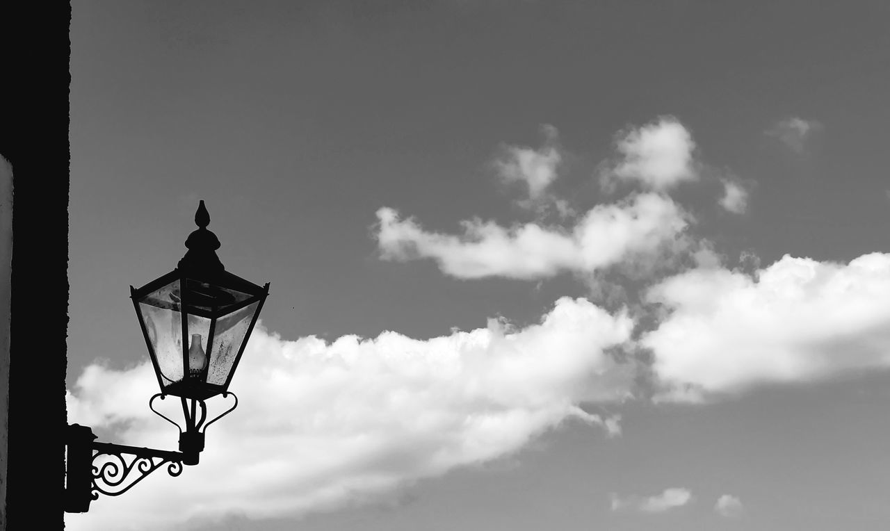 sky, cloud, black and white, street light, lighting equipment, monochrome photography, black, monochrome, nature, low angle view, no people, architecture, white, darkness, light, street, lighting, outdoors, day, built structure, silhouette
