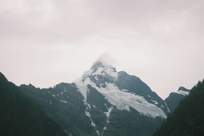 Scenic view of mountains against sky during winter