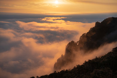 Low angle view of silhouette mountain against sky during sunset