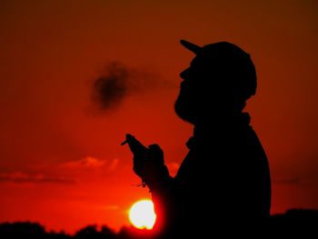 Silhouette people at sunset