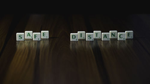 Close-up of information sign on table