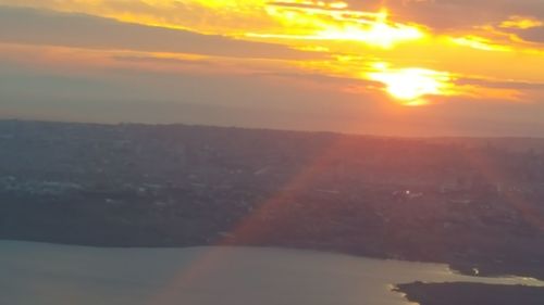 Aerial view of cityscape at sunset