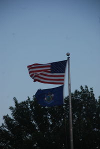 Low angle view of american flag against clear sky