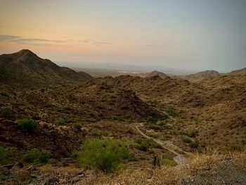 Scenic view of mountains against sky during sunset