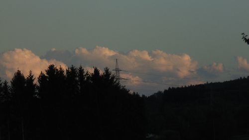 Low angle view of silhouette trees against sky at sunset