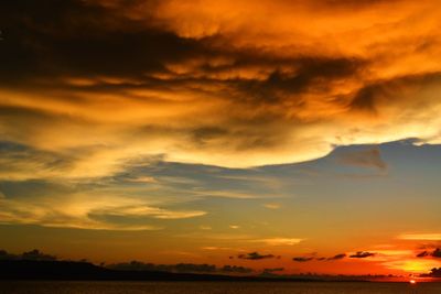 Scenic view of dramatic sky during sunset