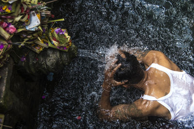 High angle view of man swimming in river