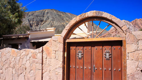 Exterior of old building against blue sky