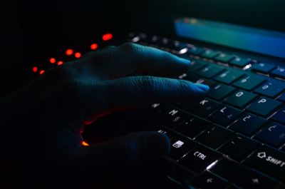 Close-up of hand using laptop