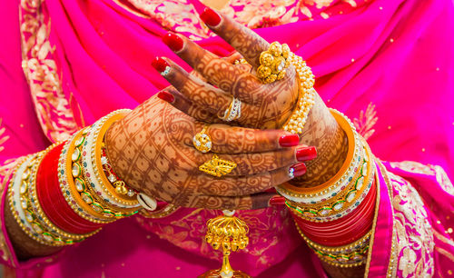 Beautiful hands of bride at indian wedding in punjabi wear