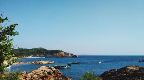 Scenic view of bay against clear sky