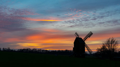 Beautiful sunset. with all colors. from blue to red. with a mill. windmill. still-life. 
