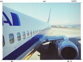 Low angle view of cropped car against clear sky