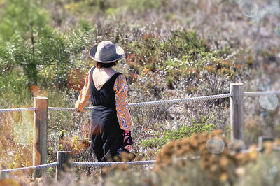 Rear view of man standing in park