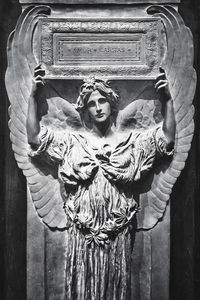 Close-up of woman standing on wall