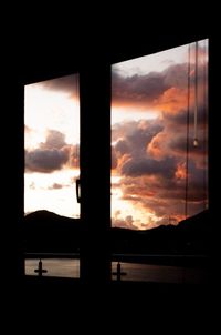 Scenic view of dramatic sky seen through window