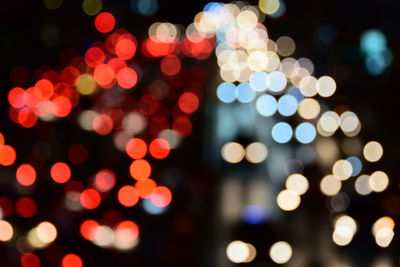 Defocused image of illuminated lights at night