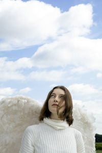 Teenage girl in white angel costume