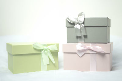 Clothes drying on paper against white background