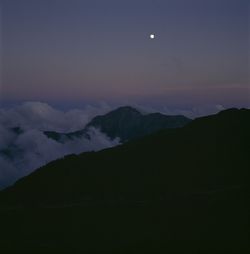 Scenic view of landscape against sky at dusk