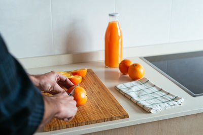 Midsection of man preparing food on table at home