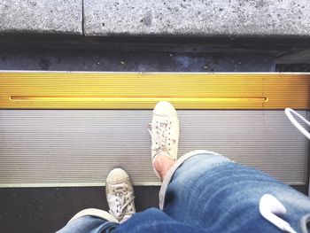 Low section of man traveling on train