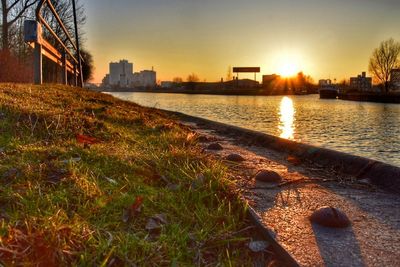 Scenic view of river against sky during sunset