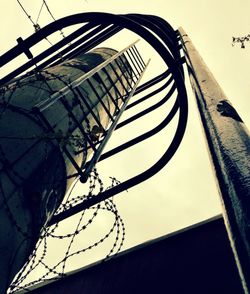 Low angle view of cables against sky