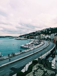 High angle view of harbor by sea against sky