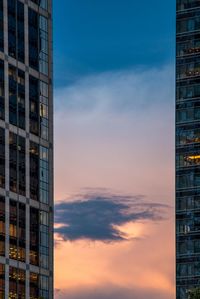 Low angle view of buildings against sky during sunset