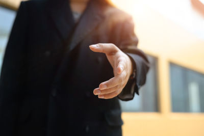Close-up of businessman using mobile phone