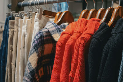 Close-up of clothes hanging on rack in store