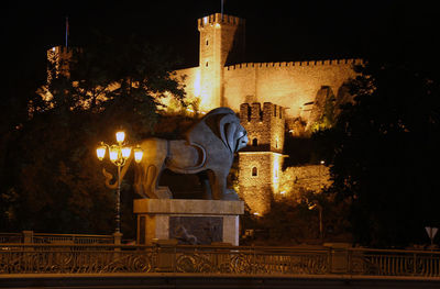 Illuminated sculpture of building at night