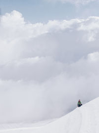 High angle view of person skiing on snow covered landscape